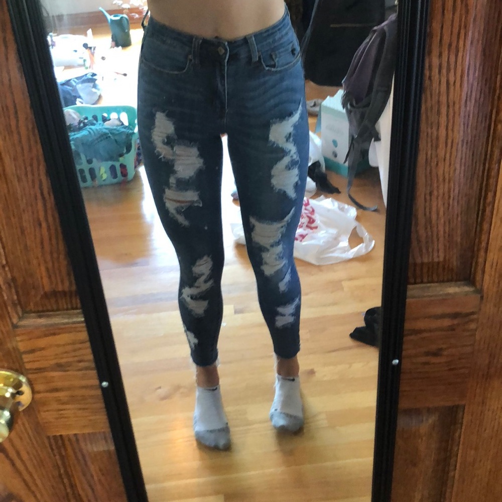 Distressed skinny blue jeans